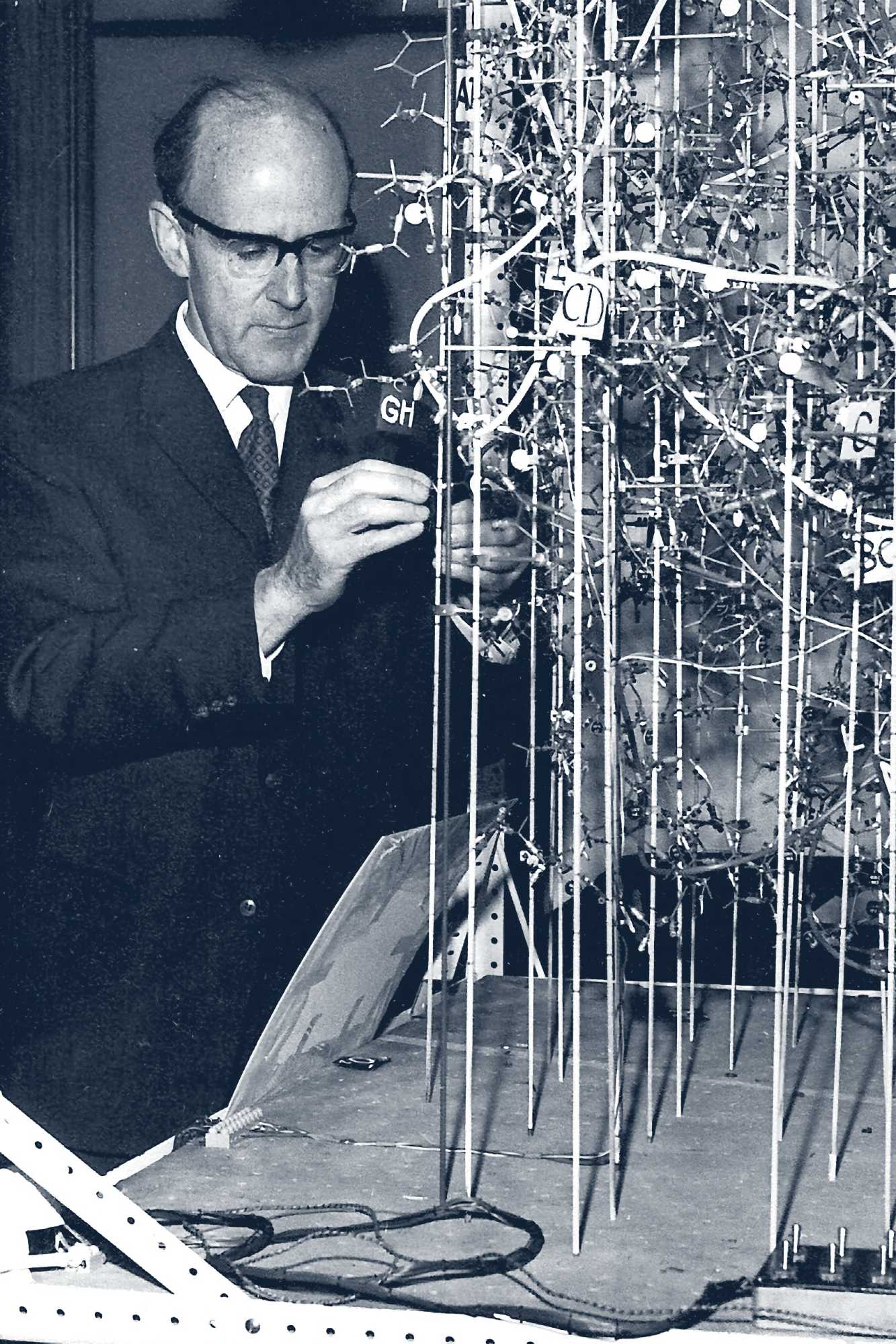 Portrait of Max Perutz working in his laboratory