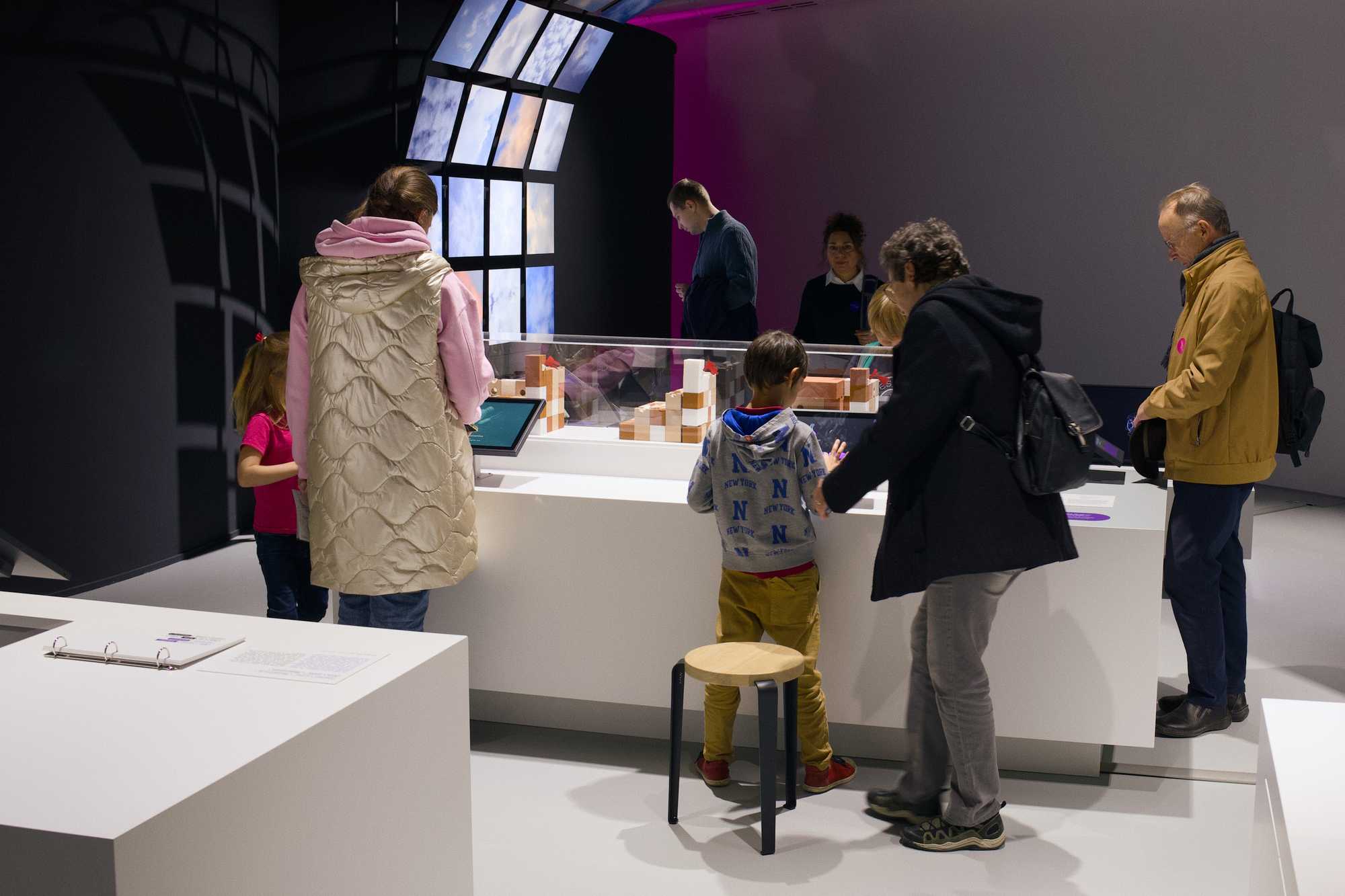 Visitors engaging with the interactive installation