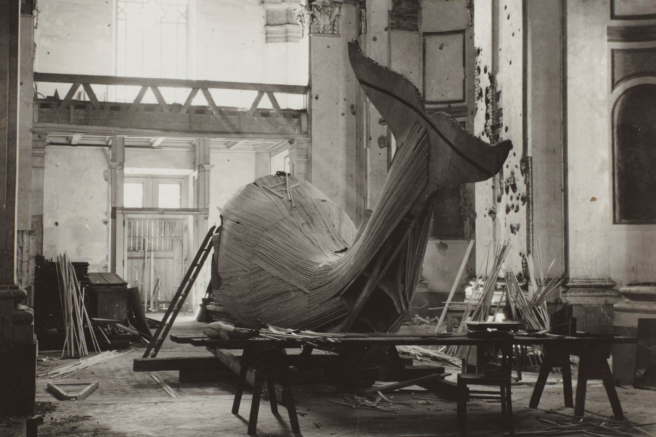 Close-up detail of wooden whale fin during construction