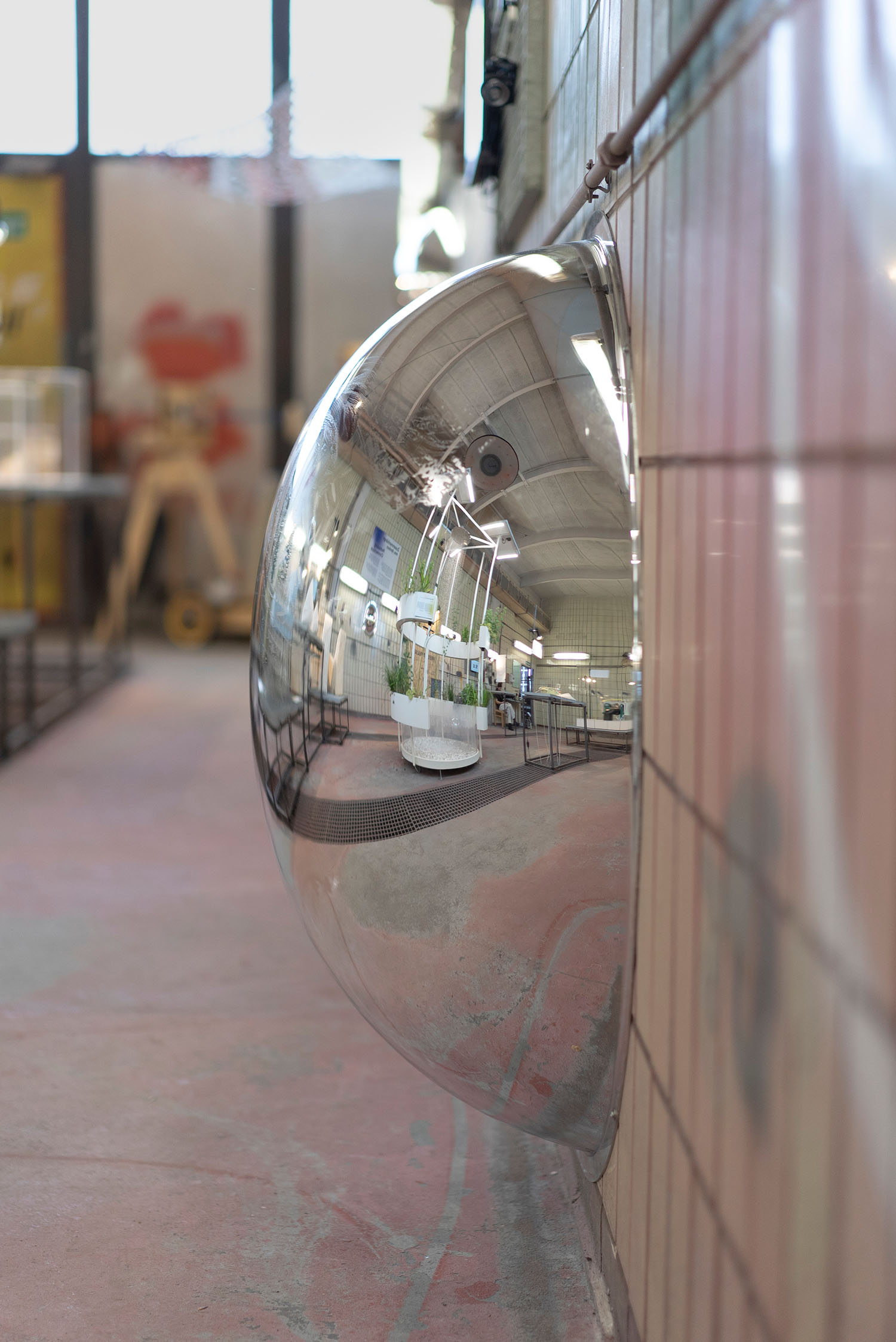 Close-up shots of a 1-meter convex traffic mirror mounted just above the ground