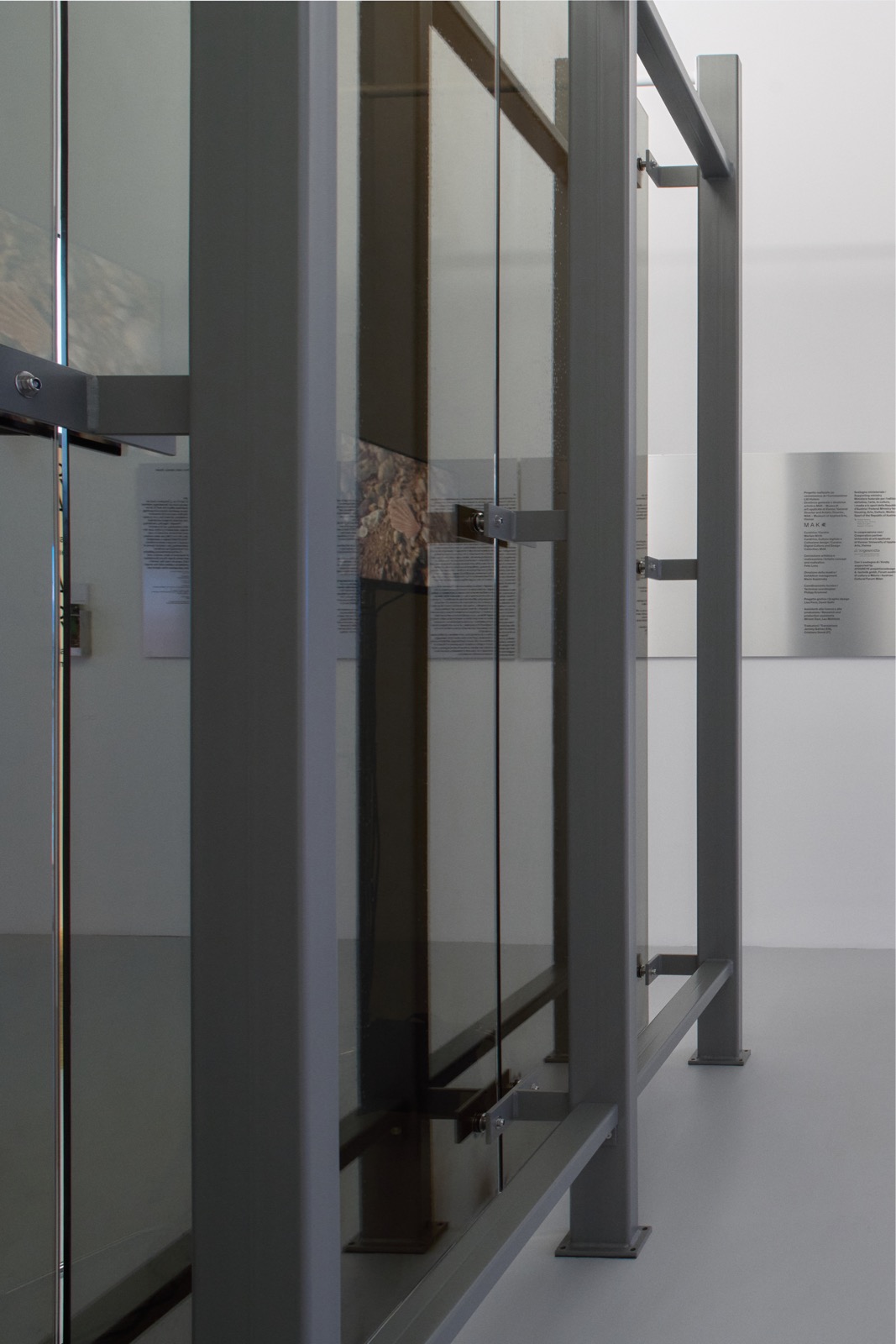 the steel beams supporting the mirrored wall piece