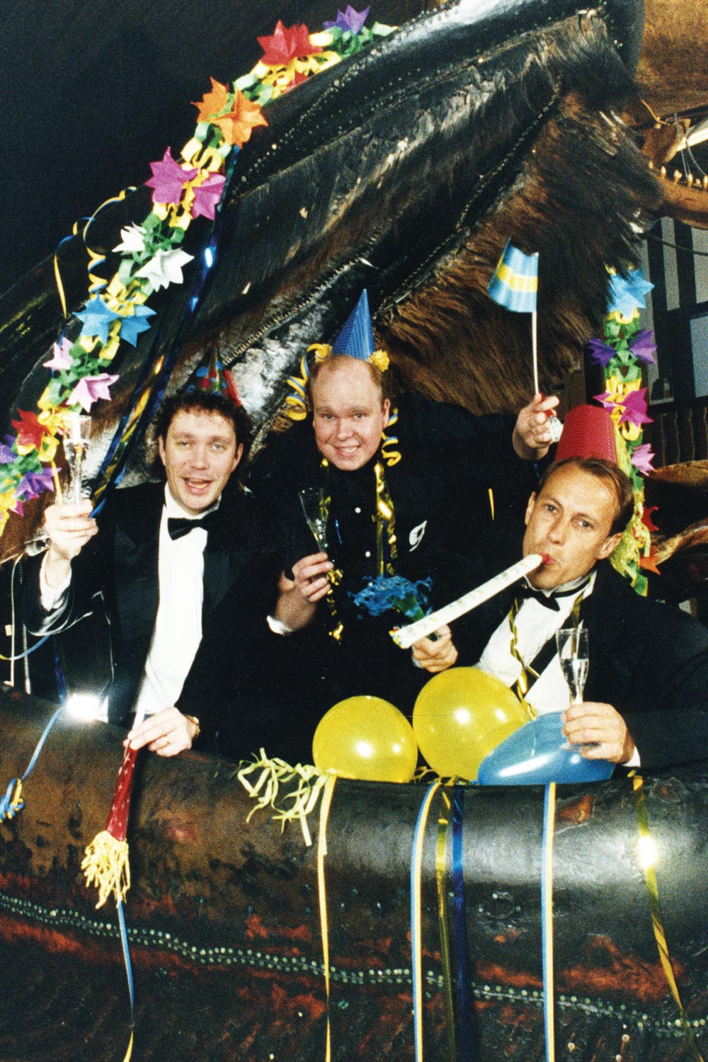 Vintage colored photograph showing crowd gathered inside a taxydermied whale